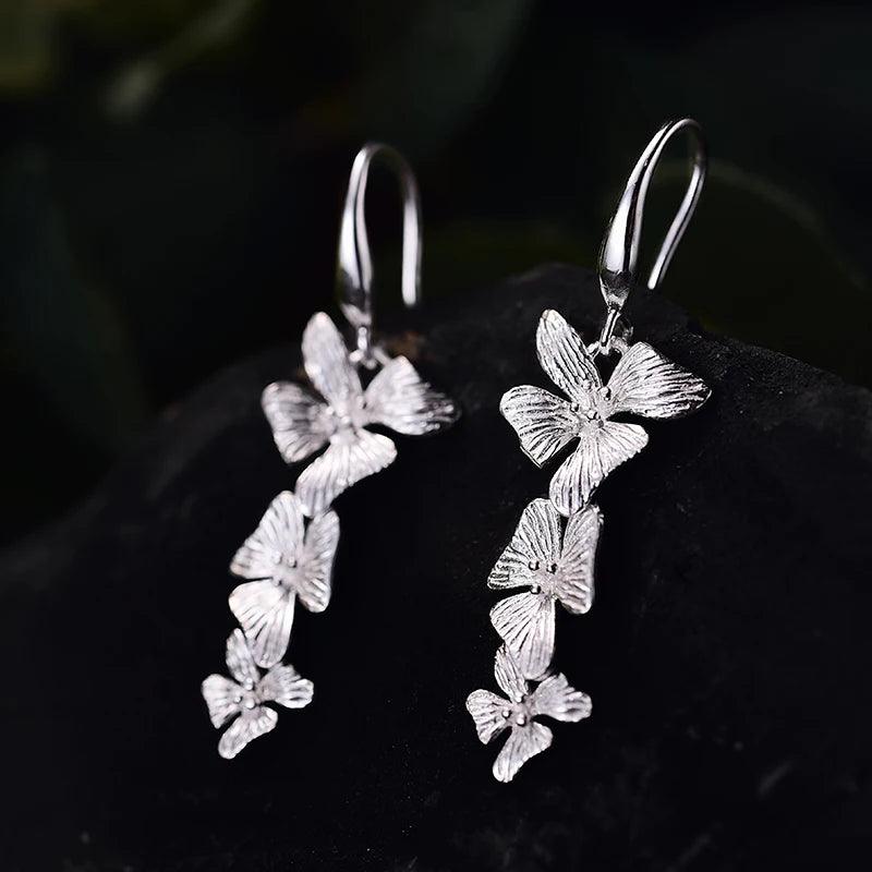 Boucles d'oreilles orchidées pendantes | Argent 925 détails plaqué Or 18K